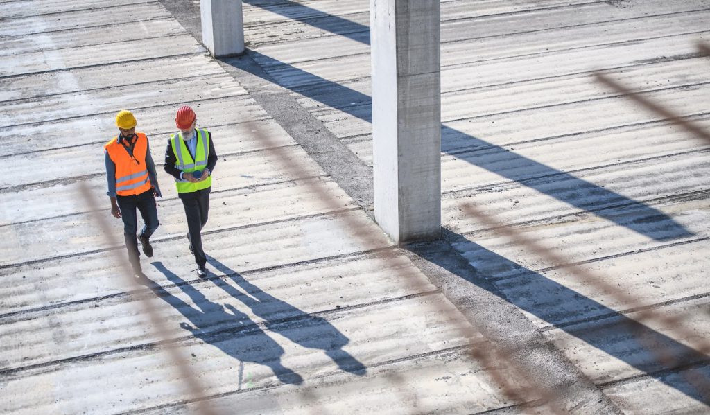 Engineers visiting an industrial construction site